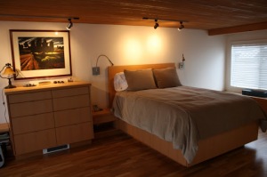 Built-in Captain's Bed with built-in shelving storage and dresser.